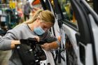 Marianne Kidd works on the Trim line, where doors are assembled before being attached to the truck.